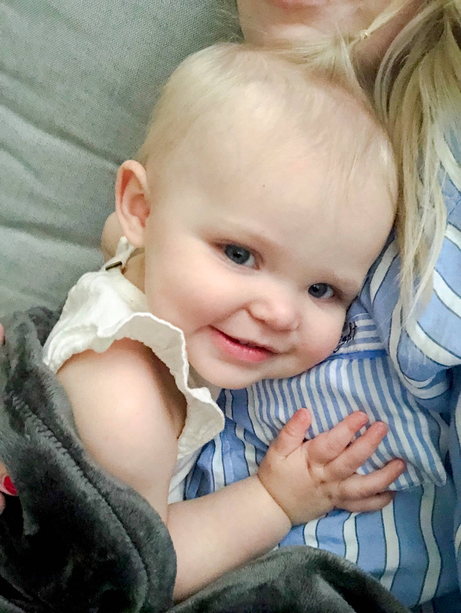 Monroe is registered to the contest to win money with this photo: baby, blond, cheek, child, ear, eye, face, finger, gesture, hand, joy, lip, nose, person, sitting, skin, smile, thumb, toddler