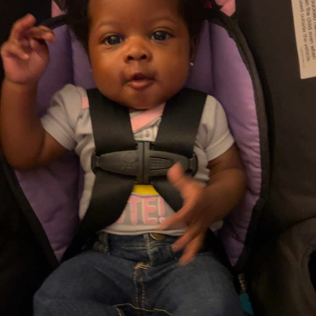 Kaisli is registered to the contest to win money with this photo: baby, bodypart, car, car_interior, carseat, clothing, cushion, face, finger, hand, head, homedecor, jeans, pants, person, photography, portrait, sitting, transportation, vehicle