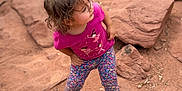 Julieta joined the competition — help win amazing prizes! adventure, ballerina_print, casual_clothing, child, curious, daylight, dirt, floral_leggings, hands_on_hips, looking_away, nature, outdoor, pink_shirt, portrait, red_rocks, rocky, standing, toddler, turquoise_sneakers, young_child