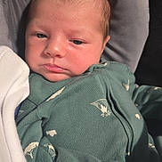 Sonic joined the competition — help win amazing prizes! baby, infant, onesie, green_clothing, blanket, sleepy, face, newborn, soft_light, cute, cozy, child, portrait, closeup, resting, indoors, young, skin, head, expression