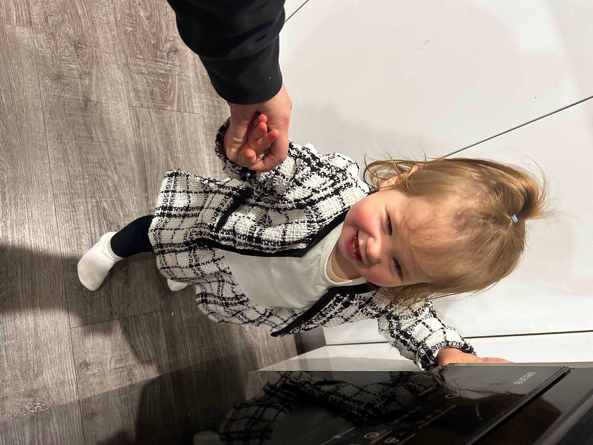 Lennon joined the competition — help win amazing prizes! child, denim, elbow, flooring, fun, gesture, happy, human_body, human_leg, joy, pattern, person, plaid, sitting, sleeve, smile, t_shirt, toddler, wood