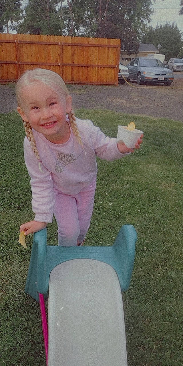 Paislee joined the competition — help win amazing prizes! baby_toddler_clothing, car, chair, fun, grass, grass_family, happy, human_body, joy, lap, leisure, magenta, person, pink, sitting, sleeve, smile, toddler, truck, vehicle