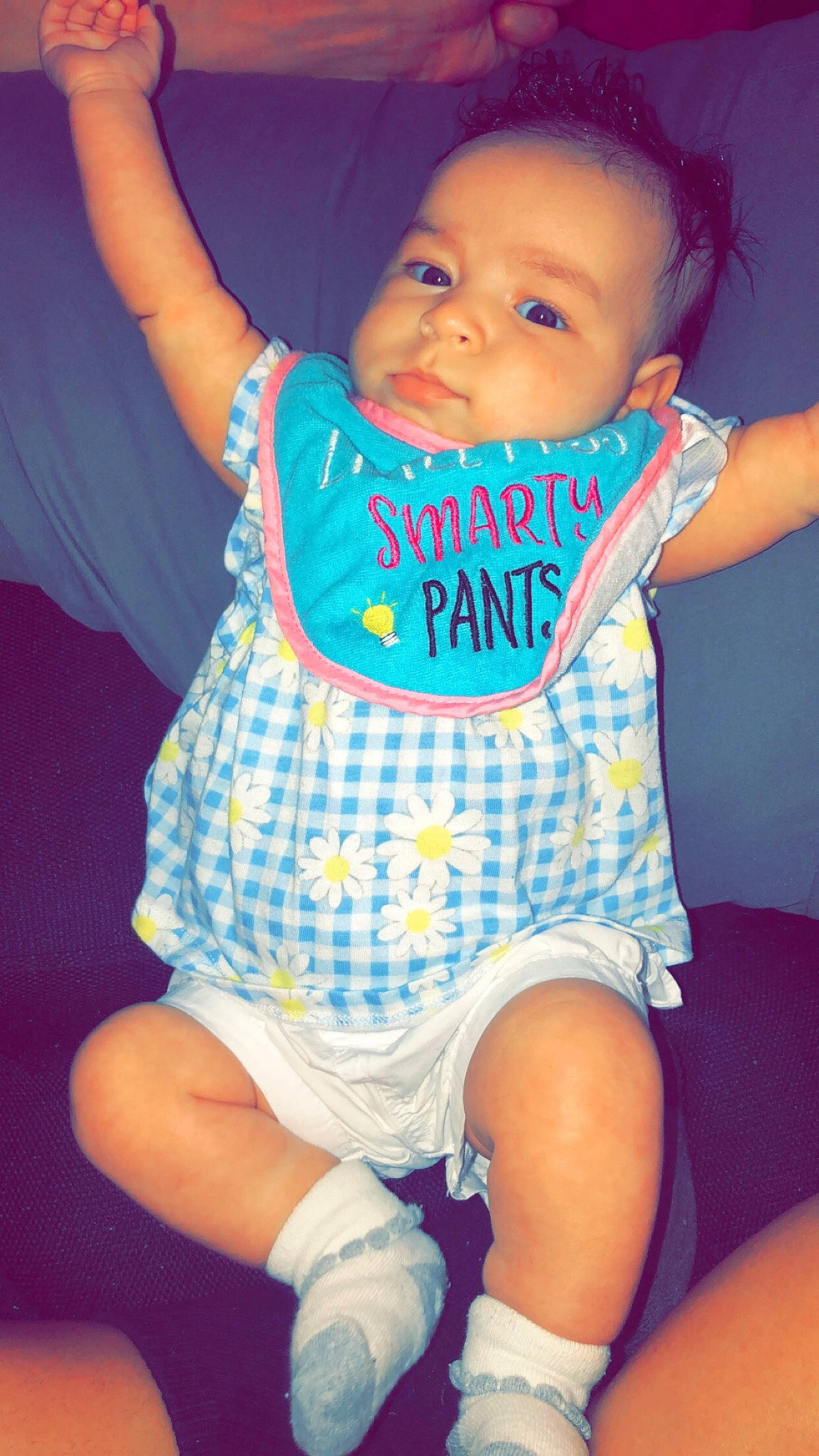 Jada is registered to the contest to win money with this photo: blue, cheek, child, cool, day, eye, facial_expression, fun, girl, hand, human_hair_color, infant, leg, person, pink, product, purple, sitting, skin, smile