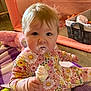 Isabella joined the competition — help win amazing prizes! baby, bodypart, couch, cream, cutlery, dessert, eating, face, finger, food, furniture, hand, head, icecream, icing, person, photography, sitting, spoon, sweets