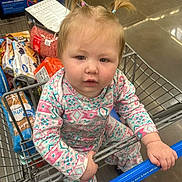 Isabella is registered to the contest to win money with this photo: baby, babycrawling, crawling, cricket, cricketbat, face, hair, head, person, pushing, shopping, shoppingcart, sport