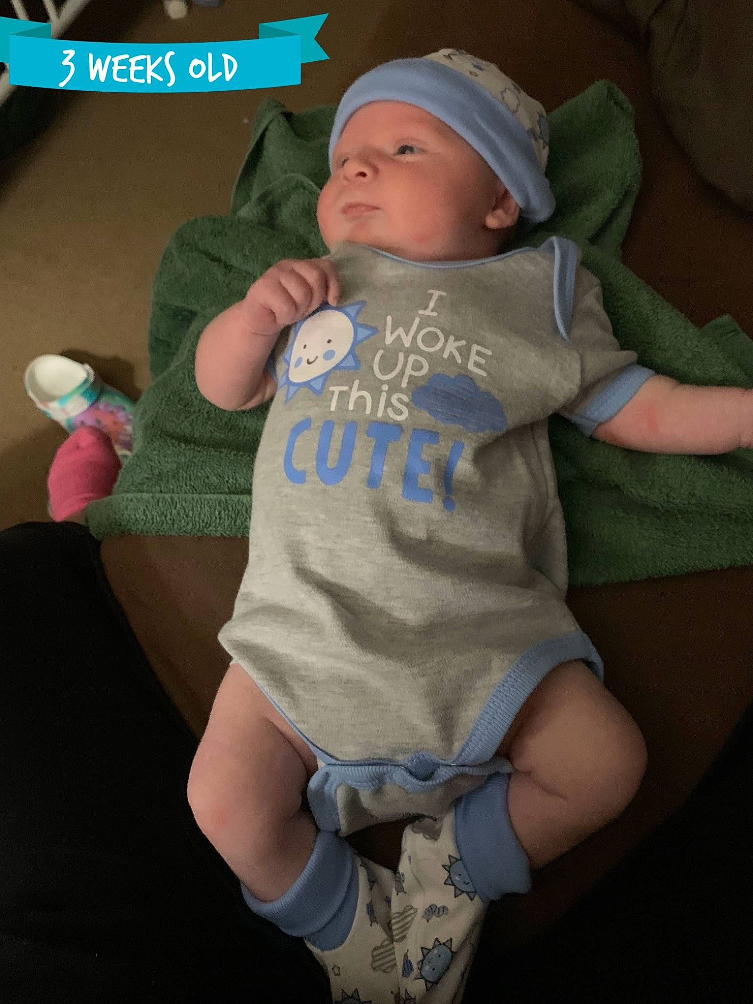 Reagan is registered to the contest to win money with this photo: abdomen, baby, baby_products, baby_toddler_clothing, baseball_cap, cap, cheek, child, face, fun, gesture, happy, hat, headgear, headwear, person, personal_protective_equipment, sitting, sleeve, t_shirt