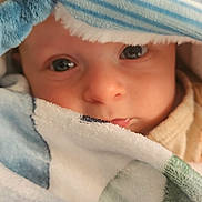 Louis a rejoint le concours — aidez-le/la à gagner de superbes lots ! baby, infant, child, blanket, towel, striped_hat, closeup, portrait, eyes, face, nose, mouth, drool, cozy, soft_texture, fabric, wrapped, indoor, cute, sleepy