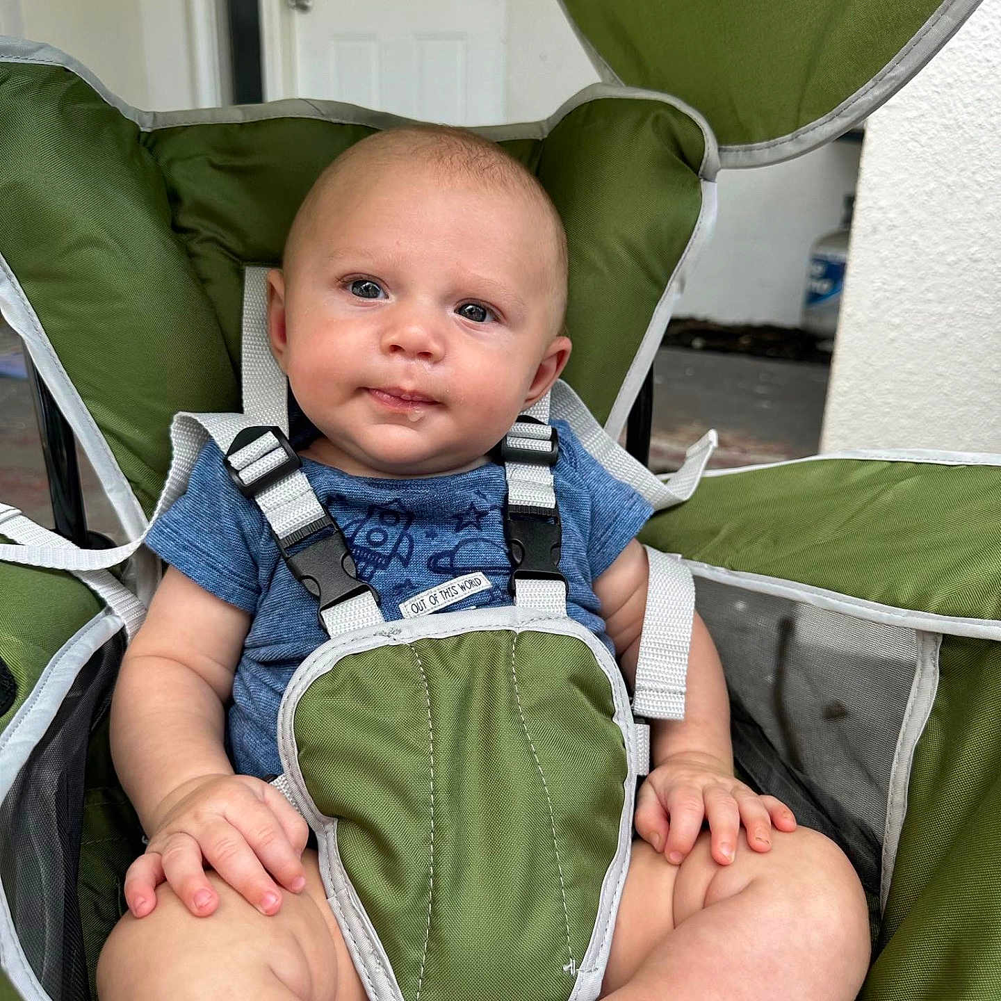 Waylyn is registered to the contest to win money with this photo: accessories, baby, clothing, coat, cushion, face, furniture, happy, head, homedecor, jacket, jeans, pants, person, photography, portrait, sitting, smile, strap, stroller
