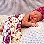 Rachel is registered to the contest to win money with this photo: newborn, baby, sleeping, blanket, headband, pink, floral, flower_pattern, cozy, soft, texture, resting, infant, cute, peaceful, portrait, child, wrapped, hands, feet