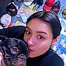 Nutella is registered to the contest to win money with this photo: accessories, affection, black_clothing, brown_eyes, close_up, collar, cozy, dog, dog_face, french_bulldog, hats, indoors, kiss, person, pet, portrait, selfie, short_hair, woman, wrinkled_face