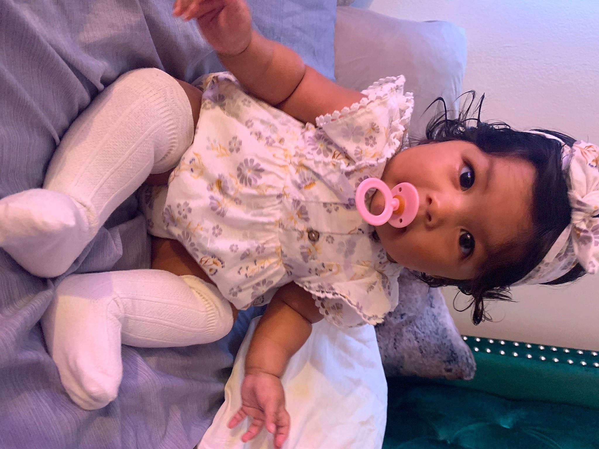 Ocean is registered to the contest to win money with this photo: abdomen, arm, baby_toddler_clothing, comfort, eyelash, finger, fun, gesture, glasses, hand, happy, head, human_body, joint, mouth, person, pink, skin, thigh, toddler