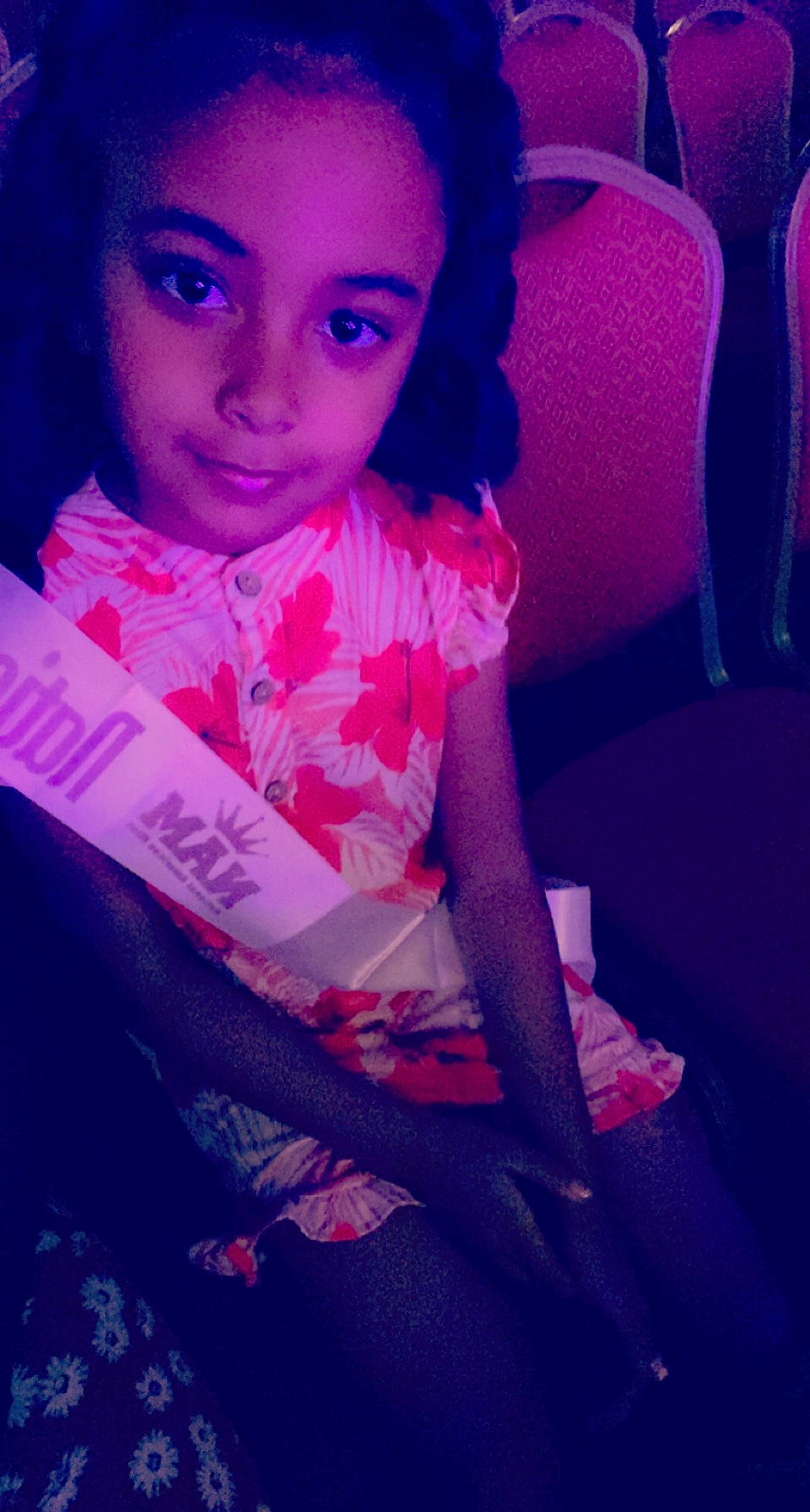 Justice is registered to the contest to win money with this photo: blue, chair, cloud, cool, eye, eyebrow, eyelash, face, flash_photography, hair, hairstyle, happy, head, human_body, iris, lip, magenta, organ, person, pink