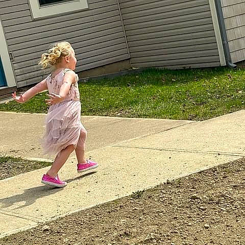 Raelea joined the competition — help win amazing prizes! asphalt, dress, electric_blue, eyewear, foot, grass, human_leg, leg, leisure, people_in_nature, person, plant, recreation, road, road_surface, sandal, sidewalk, sitting, toddler, waist