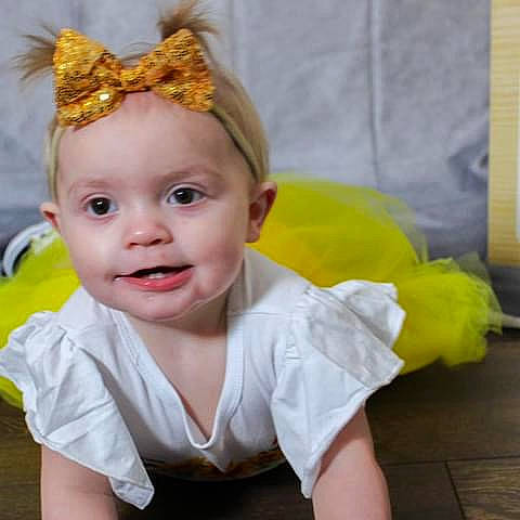 Michaela joined the competition — help win amazing prizes! baby, baby_toddler_clothing, blond, bridal_accessory, cheek, child, costume_hat, crown, fashion_accessory, flash_photography, fun, happy, headband, headpiece, iris, jewellery, person, sleeve, smile, tiara