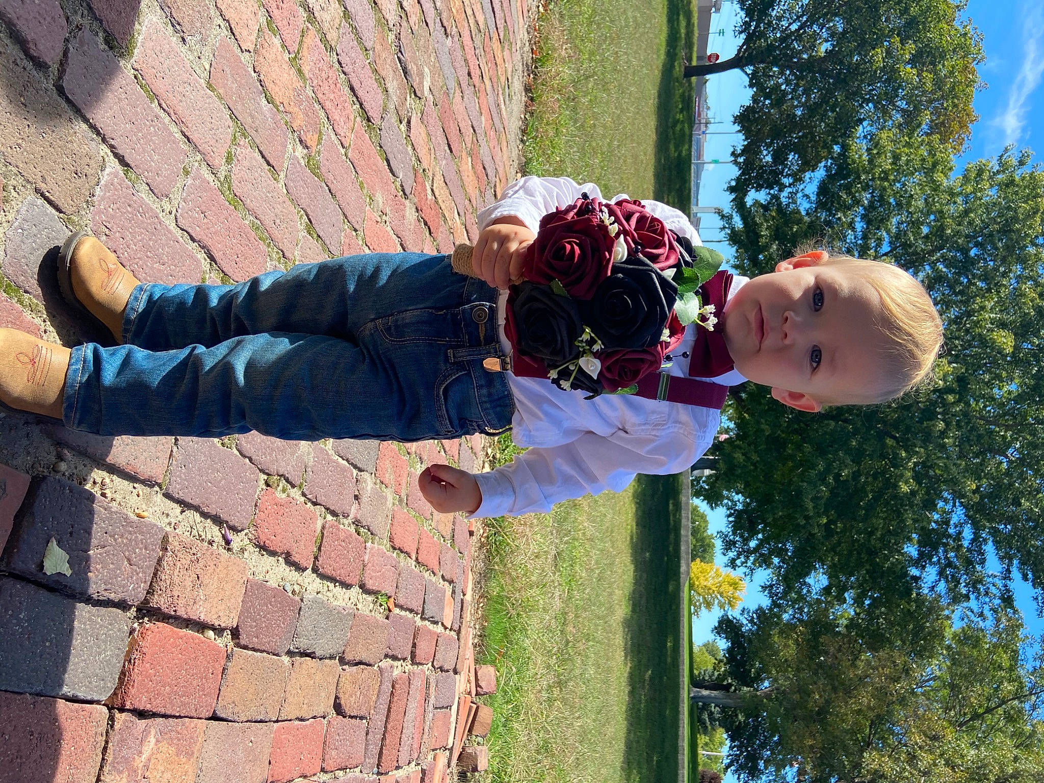 Layken joined the competition — help win amazing prizes! brick, brickwork, child, cobblestone, flooring, fun, grass, happy, hat, leaf, leisure, pattern, people_in_nature, person, plant, road_surface, sitting, sky, toddler, tree