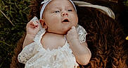 Lakelynn joined the competition — help win amazing prizes! baby, infant, lace_clothing, headband, flower, sunflower, blanket, outdoor, grass, greenery, cute, lying_down, portrait, child, soft_texture, nature, baby_girl, peaceful, small_hands, curious
