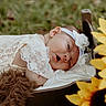 baby, baby_clothes, child, closeup, cushion, cute, flower, grass, head, headband, infant, lace, nature, outdoor, peaceful, portrait, resting, sleeping, soft, sunflower
