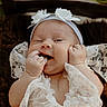 Lakelynn is registered to the contest to win money with this photo: baby, infant, lace, headband, flower, smiling, happy, cute, child, portrait, closeup, fingers, hand, outdoor, nature, greenery, soft, cozy, fabric, person