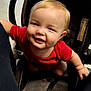 Eric is registered to the contest to win money with this photo: baby, black_pants, car_seat, car_seat_cushion, child, child_safety, cute, floor, happy, indoor, infant, legs, light_hair, person, portrait, red_shirt, seatbelt, smiling, tiled_floor, young_child