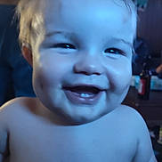 Eric is registered to the contest to win money with this photo: baby, blue_tint, blurry_background, cheeks, child, closeup, cute, expression, face, happy, head, human, indoor, infant, person, portrait, skin, smile, tooth, young