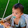 Tobias joined the competition — help win amazing prizes! baby, pacifier, swing, grass, outdoor, child, hand, wood, green, potted_plant, clothing, infant, cute, portrait, nature, seat, summer, play, face, garden