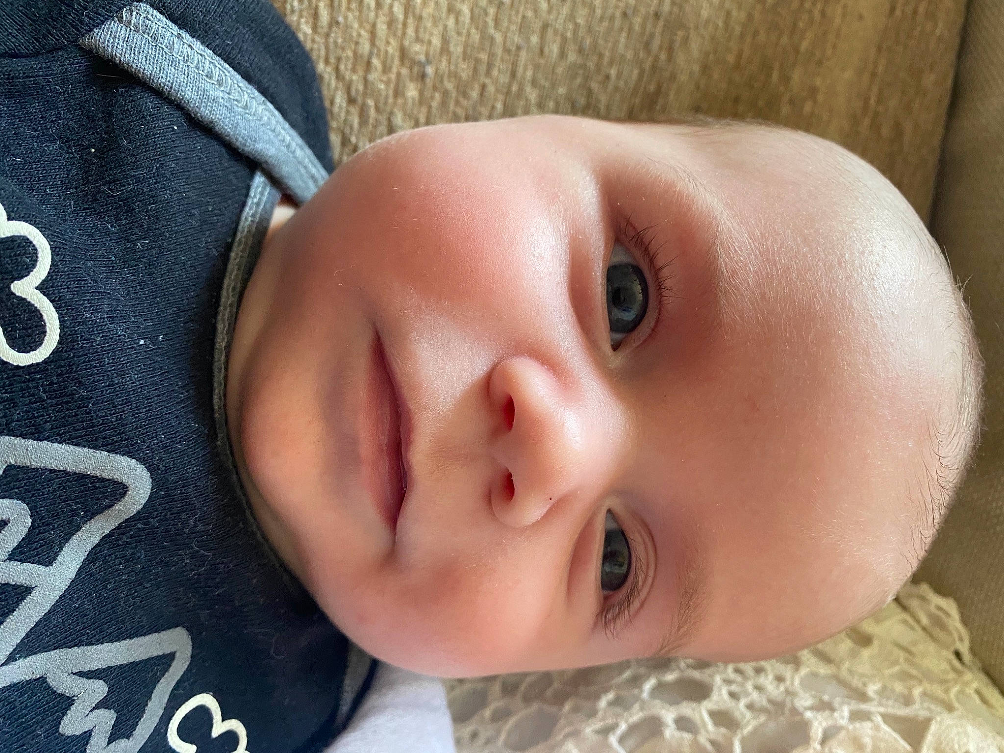 Elijah is registered to the contest to win money with this photo: baby, baby_toddler_clothing, cheek, child, chin, close_up, comfort, eyebrow, eyelash, face, forehead, happy, headgear, lip, mouth, nose, organ, person, skin, smile