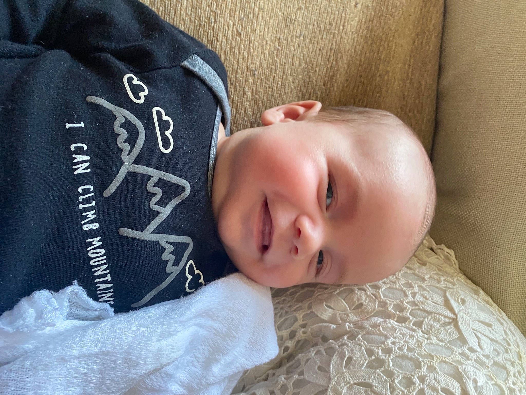 Elijah is registered to the contest to win money with this photo: child, comfort, cool, eye, flash_photography, grass, grey, happy, head, human_body, linens, pattern, person, portrait_photography, sitting, sleeve, smile, t_shirt, textile, toddler