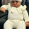 baby, baby_clothing, bow, chair, cheeks, child, curtain, face, furniture, indoors, infant, knit_hat, leather_chair, onesie, photography, pom_poms, portrait, pouting, sitting, white_outfit