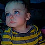 toddler, child, face, blue_eyes, striped_shirt, yellow, gray, indoor, portrait, freckles, heart_shapes, long_eyelashes, cute, young_child, expression, looking_away, soft_lighting, casual_clothing, person, baby
