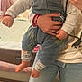 baby, child, smiling, happy, indoor, mirror, selfie, person, holding, clothing, toddler, long_sleeve, patterned_leggings, jeans, ripped_jeans, hand, bedroom, furniture, home, casual