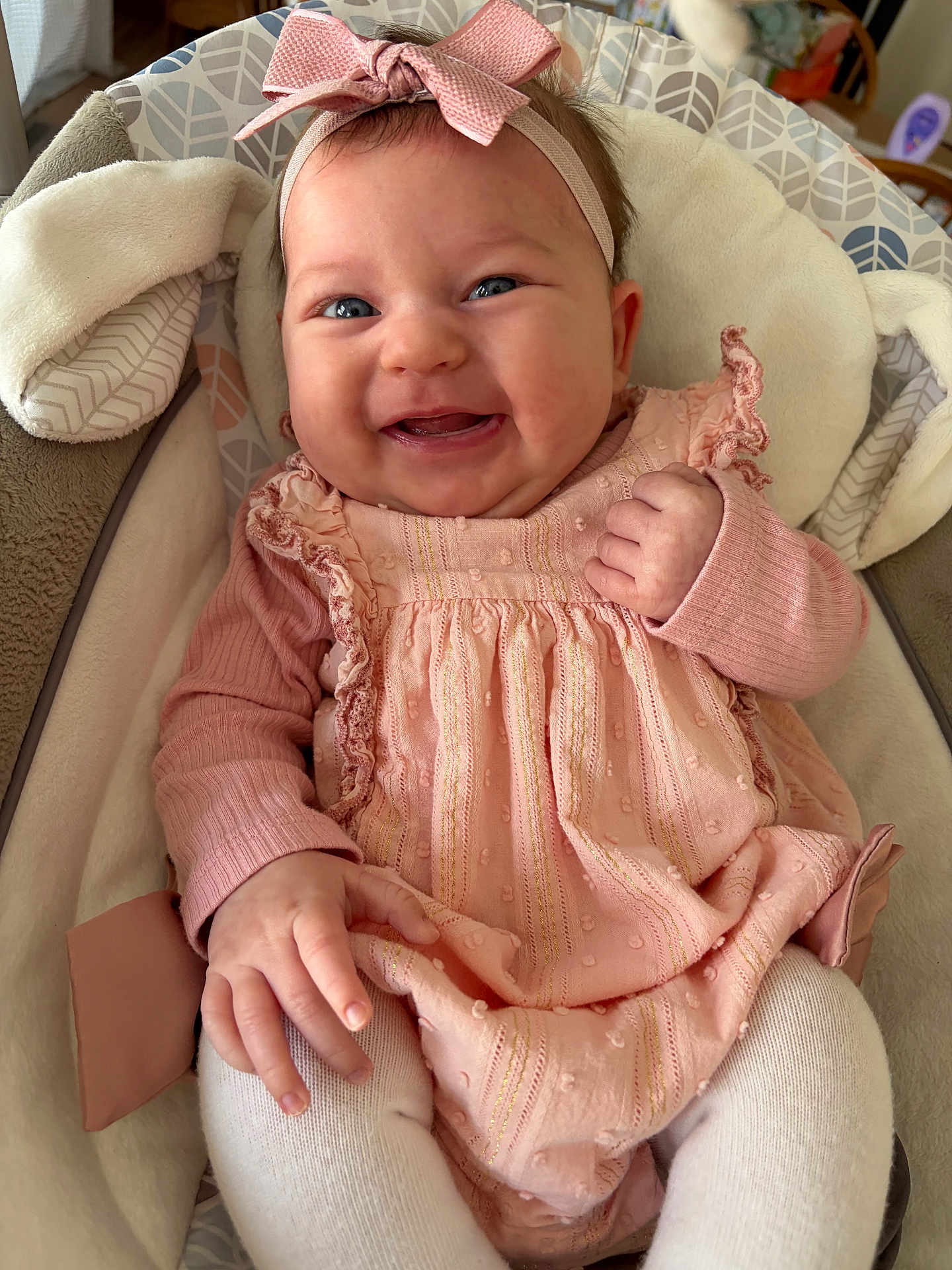 Blakely joined the competition — help win amazing prizes! baby, infant, child, smiling, headband, bow, pink_dress, dress, cheeks, hand, fingers, legs, tights, baby_seat, blanket, fabric_pattern, portrait, close_up, happy, eyes