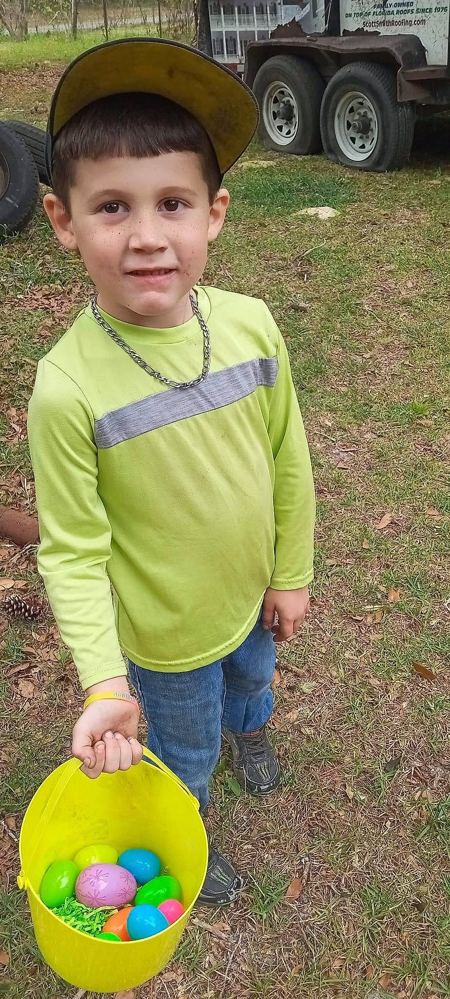 Braxton is registered to the contest to win money with this photo: child, denim, electric_blue, face, fun, grass, grassland, green, happy, head, joy, pattern, people_in_nature, person, personal_protective_equipment, recreation, sleeve, soil, t_shirt, toddler