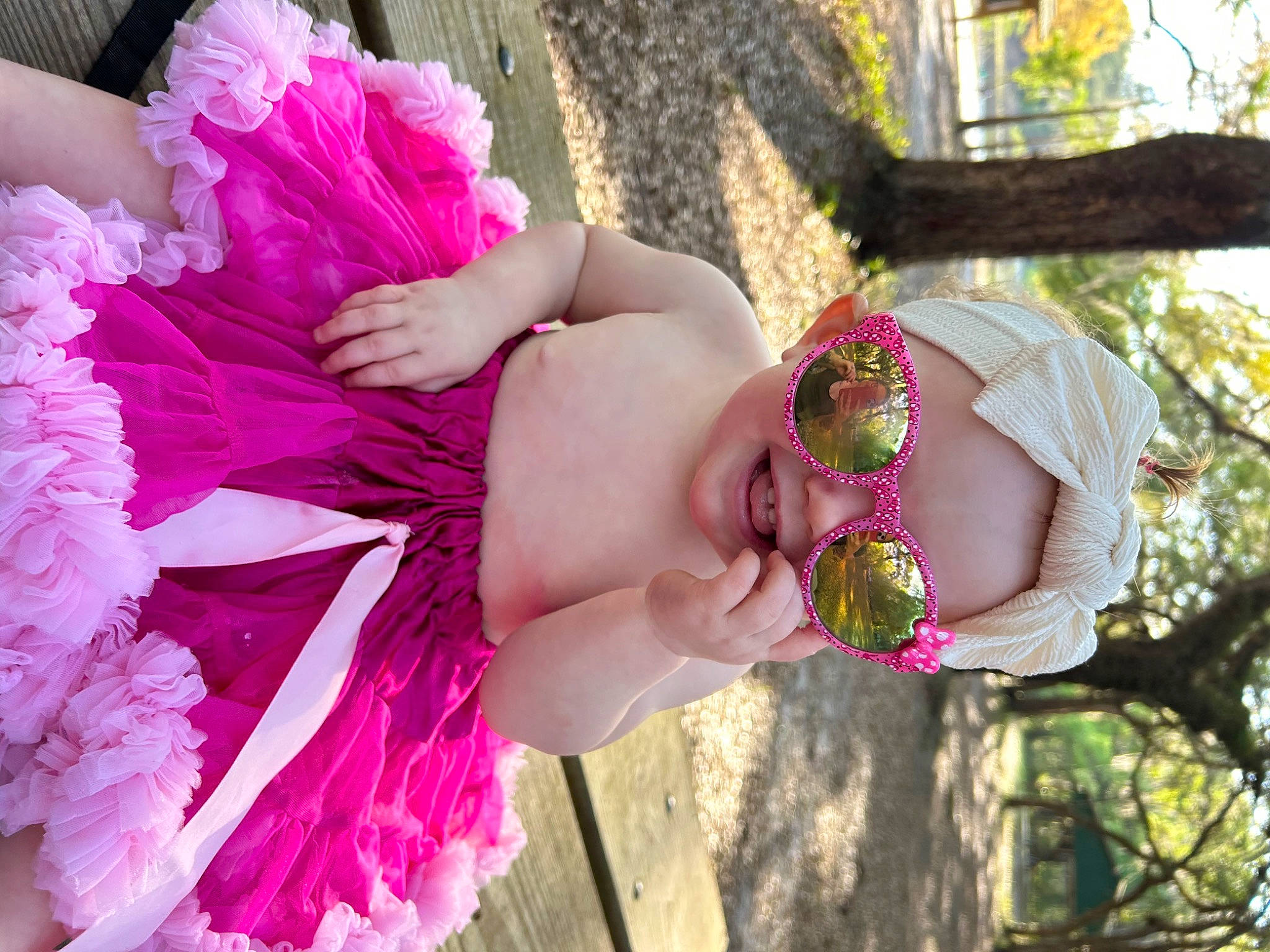 Blakeleigh is registered to the contest to win money with this photo: arm, baby, beauty, child, event, fashion_accessory, grass, happy, headgear, headpiece, magenta, people_in_nature, person, petal, pink, plant, purple, red, textile, toddler