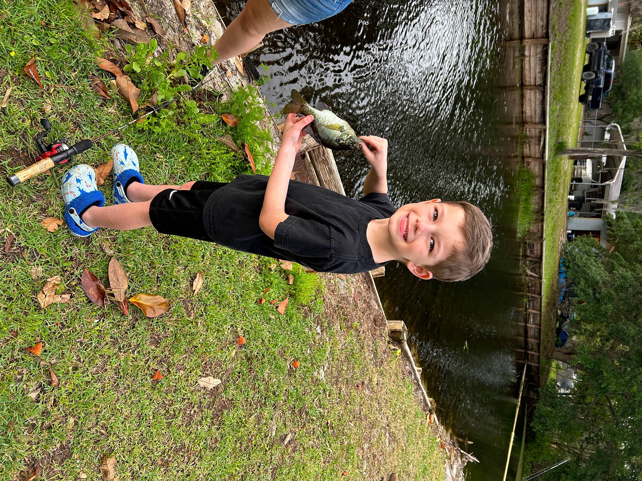 Lawrence is registered to the contest to win money with this photo: fun, garden, grass, happy, human_leg, joy, leisure, people_in_nature, person, plant, recreation, t_shirt, thigh, tree, water