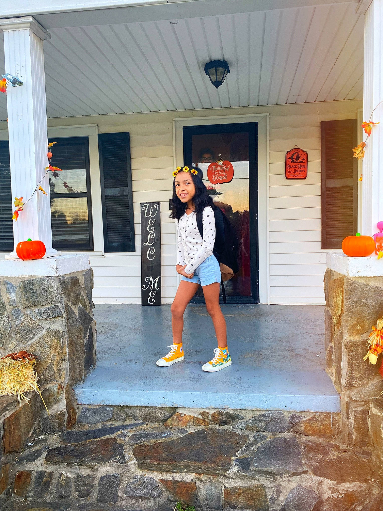 Yasmine joined the competition — help win amazing prizes! beauty, concrete, door, eyewear, flooring, fun, hat, headwear, house, human_leg, joy, leisure, luggage_and_bags, orange, people, person, road_surface, smile, standing, t_shirt