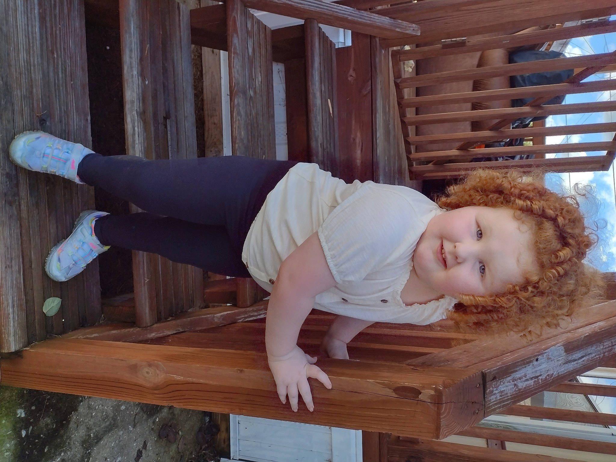 Myla joined the competition — help win amazing prizes! baby_toddler_clothing, comfort, elbow, foot, happy, hardwood, human_leg, joy, knee, lumber, outdoor_bench, outdoor_furniture, person, plank, sitting, sleeve, smile, thigh, toddler, waist