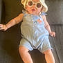 Lya participe au concours pour gagner de l'argent avec cette photo : baby, casual, child, couch, cute, fashion, foot, hand, hat, indoor, infant, person, plush, portrait, relaxing, romper, seat, skin, smiling, sunglasses