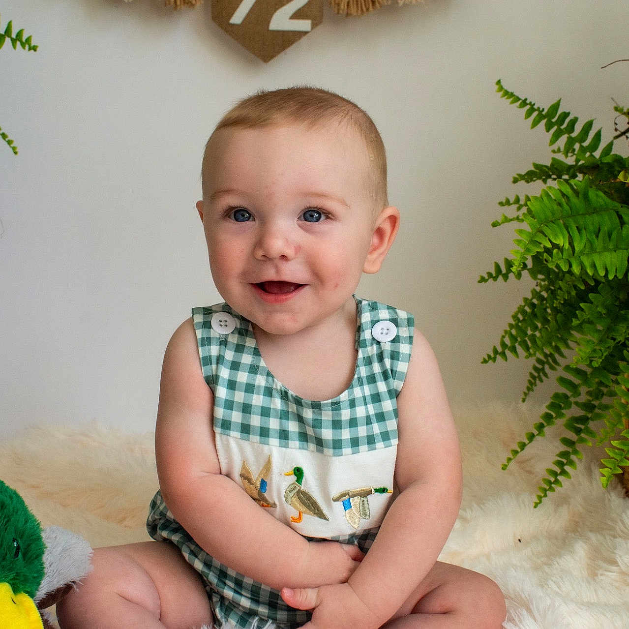 Clayton joined the competition — help win amazing prizes! baby, basket, blue_eyes, checkered_clothing, child, cute, duck, embroidery, fluffy_rug, greenery, happy, home_decor, indoor, infant, plant, plush_toy, portrait, sitting, smiling, soft_lighting