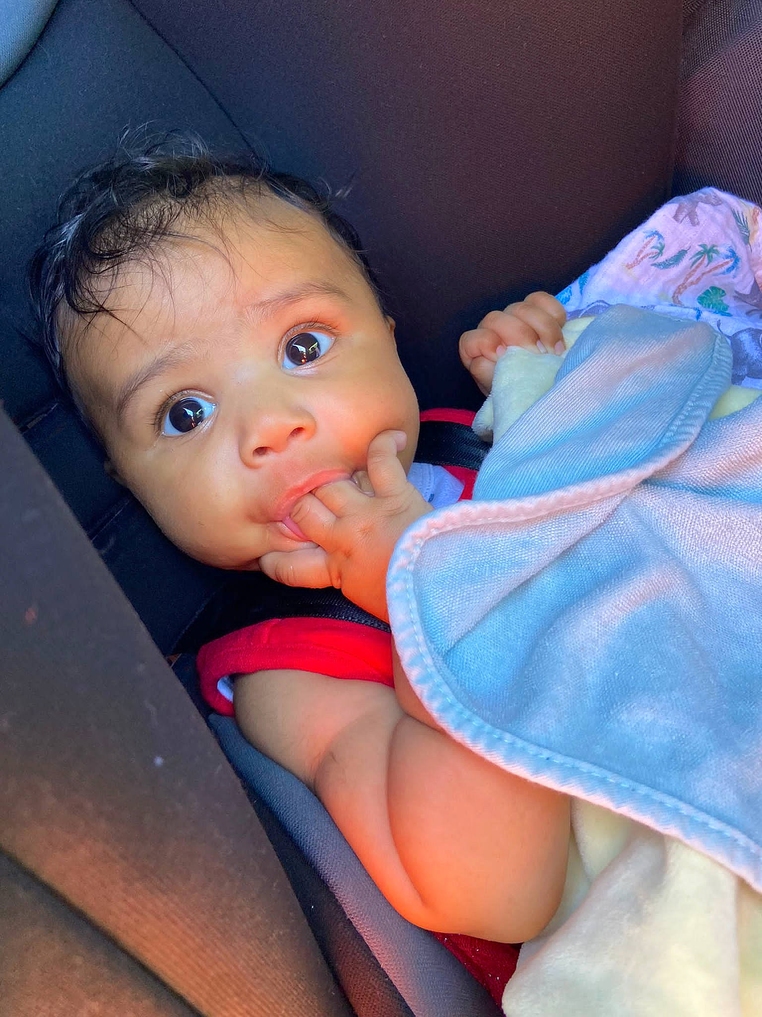 Rae is registered to the contest to win money with this photo: azure, baby, baby_toddler_clothing, cheek, comfort, eye, eyebrow, finger, gesture, hand, human_body, iris, joint, lip, mouth, nose, person, pink, skin, thumb