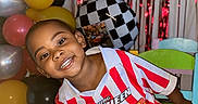 Cymbian joined the competition — help win amazing prizes! child, boy, smiling, balloons, birthday_party, chair, lightning_mcqueen, red_and_white_stripes, checkered_pattern, toy_car, indoor, celebration, happy, decorations, colorful, young_child, casual_clothing, posing, event, fun