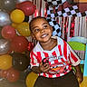Cymbian joined the competition — help win amazing prizes! child, smiling, balloons, birthday_party, colorful, indoor, cheerful, red_shirt, lightning_mcqueen, toy_car, chair, celebration, young_boy, black_hair, checkered_flag, festive, happy, casual_clothing, portrait, event