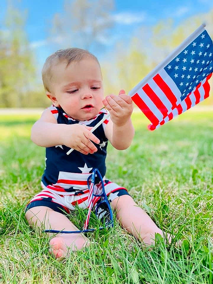 Orrin joined the competition — help win amazing prizes! baby, baby_toddler_clothing, cloud, daytime, finger, flag, flag_of_the_united_states, fun, gesture, grass, grassland, happy, leisure, meadow, people_in_nature, person, playing_with_kids, sky, summer, sunlight