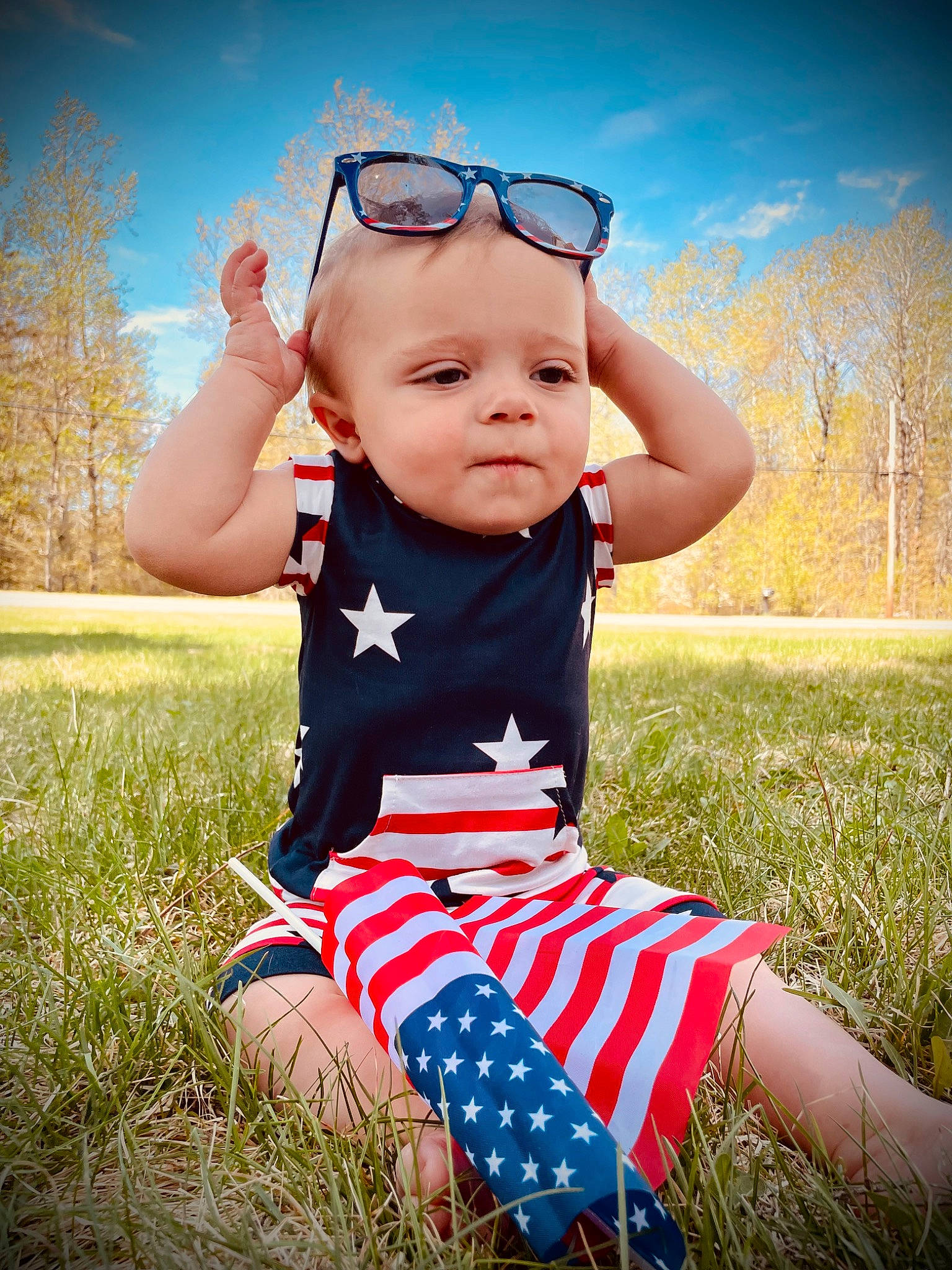 Orrin is registered to the contest to win money with this photo: azure, baby, baby_toddler_clothing, cloud, finger, flash_photography, fun, gesture, goggles, grass, happy, light, meadow, people_in_nature, person, plant, sky, summer, sunlight, toddler