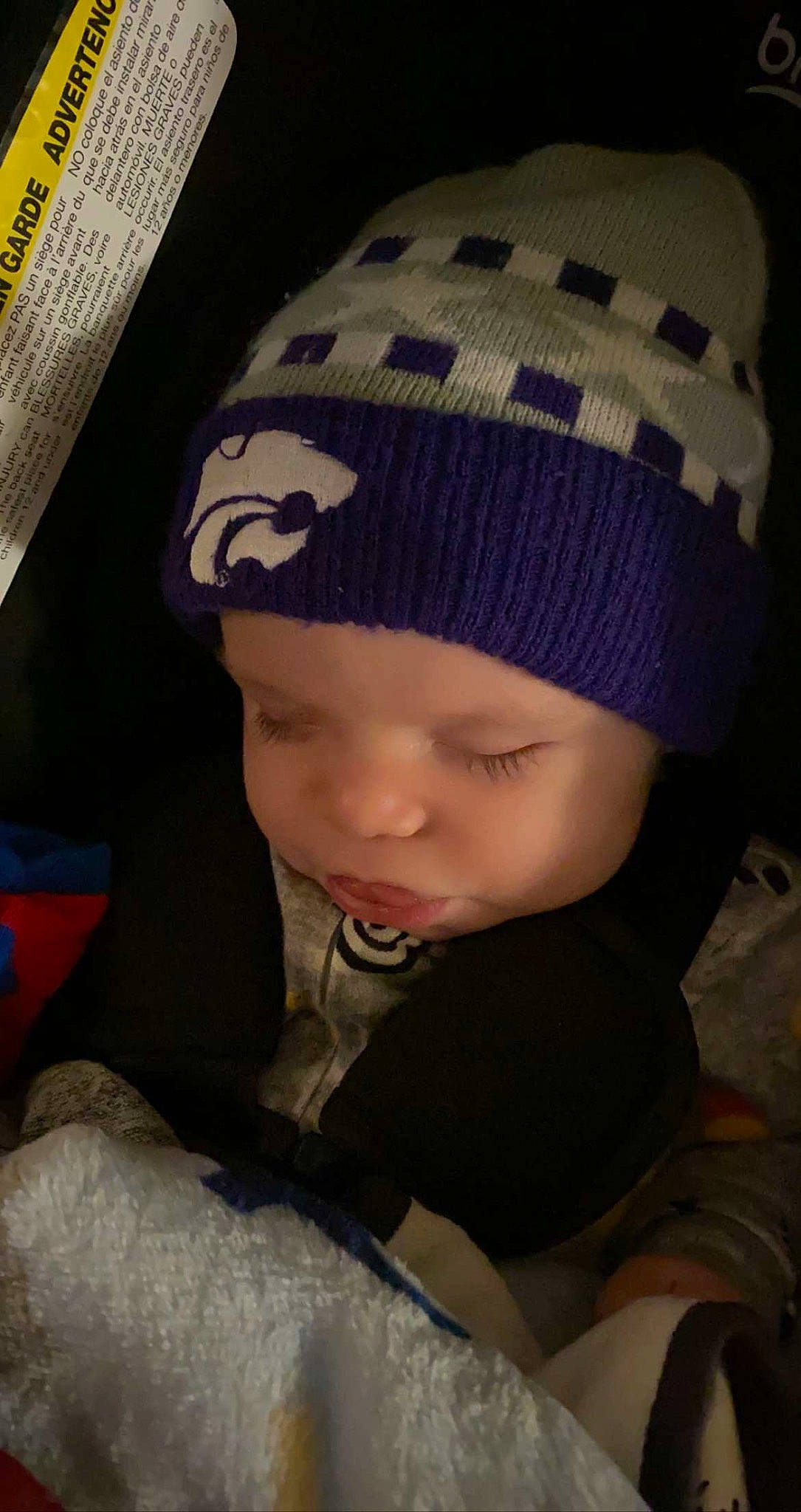 River is registered to the contest to win money with this photo: baby, baby_toddler_clothing, beanie, cap, cheek, child, comfort, cool, eye, fashion_accessory, headgear, headwear, human_body, knit_cap, outerwear, person, sitting, sleeve, toddler, winter