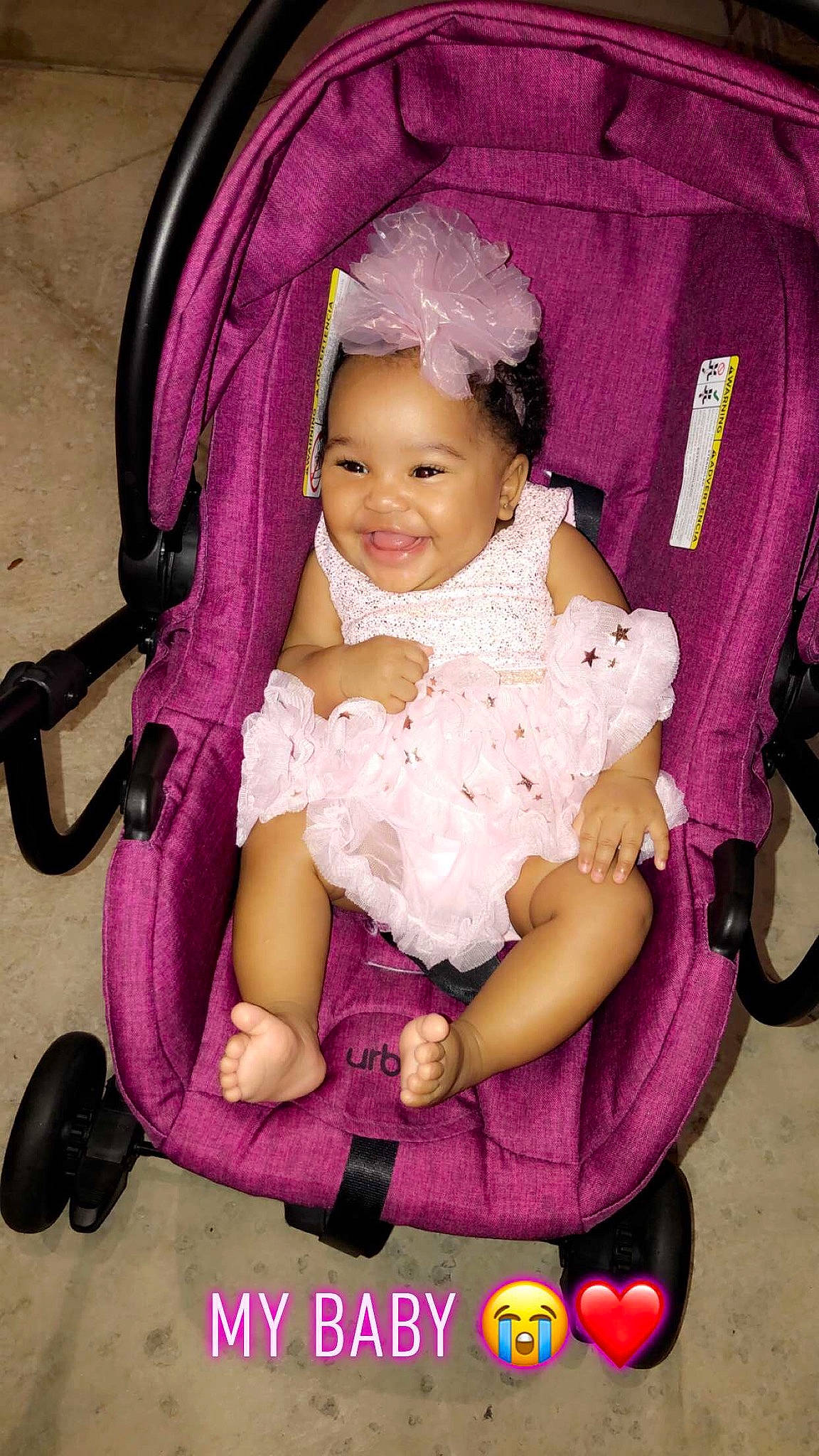 Kalia is registered to the contest to win money with this photo: baby, baby_carriage, baby_products, cheek, child, joy, magenta, person, pink, product, purple, sitting, skin, smile, toddler, violet