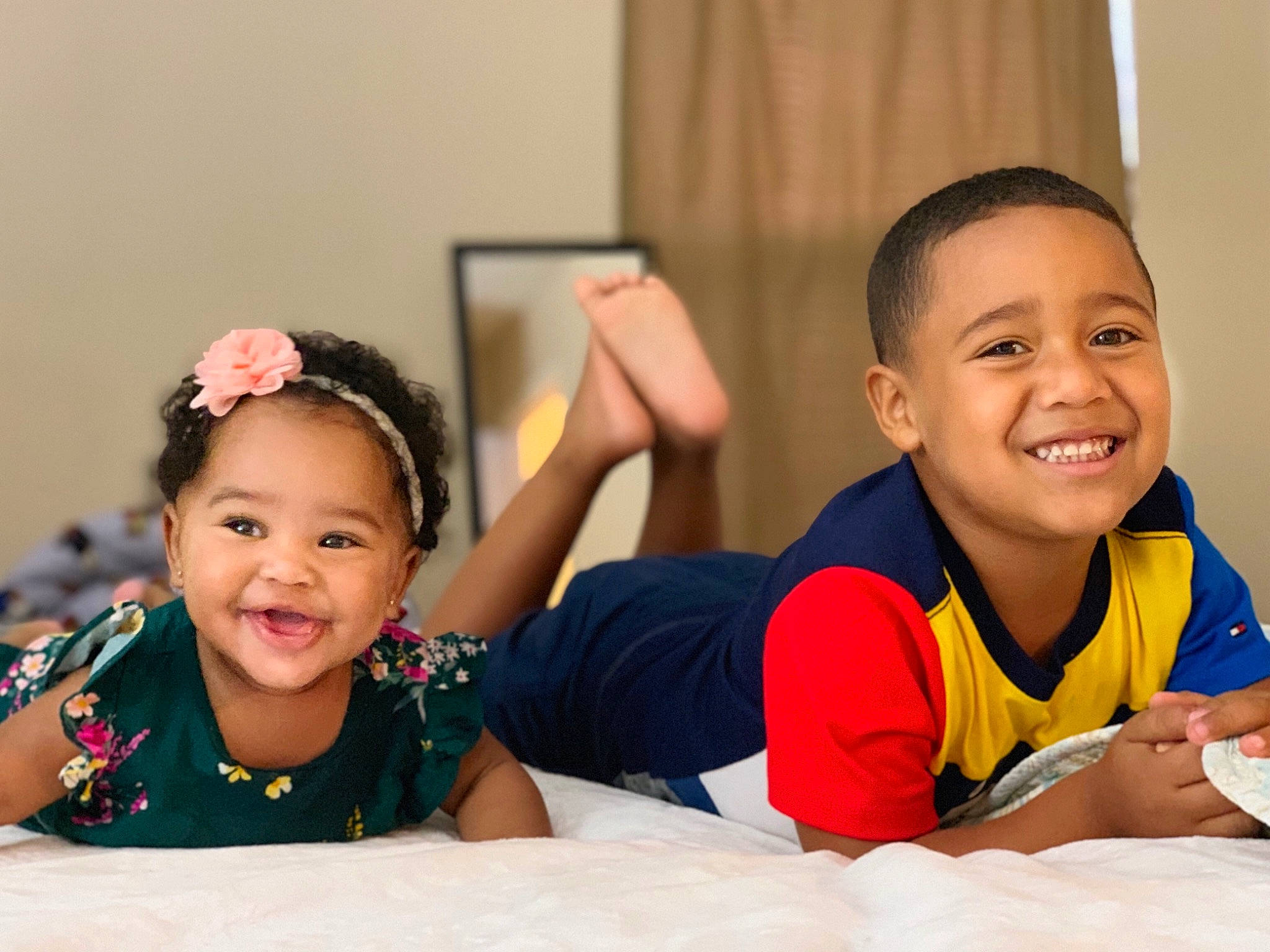 Kalia joined the competition — help win amazing prizes! child, ear, face, facial_expression, family, fun, gesture, happy, head, joy, laugh, people, person, play, room, sibling, sitting, smile, toddler, vacation