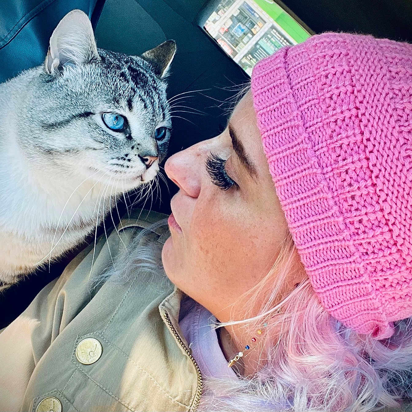 Baz is registered to the contest to win money with this photo: accessories, adult, animal, beanie, bonnet, cap, cat, clothing, face, female, hat, head, kitten, person, pet, photography, portrait, purple, selfie, woman