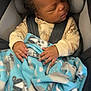 Kyaire is registered to the contest to win money with this photo: baby, sleeping, car_seat, blanket, child, infant, curly_hair, clothing, seatbelt, cozy, cute, hands, peaceful, indoor, resting, toddler, soft, comfort, young_child, safety