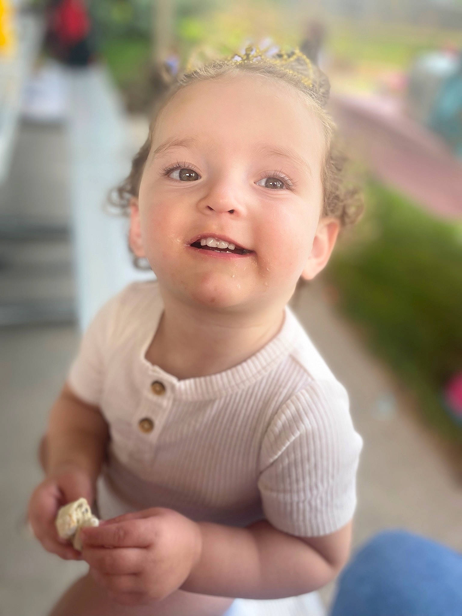 Evelynn is registered to the contest to win money with this photo: baby, baby_toddler_clothing, cheek, child, dress, eye, face, finger, gesture, happy, head, iris, joy, lip, nose, person, plant, skin, sleeve, smile