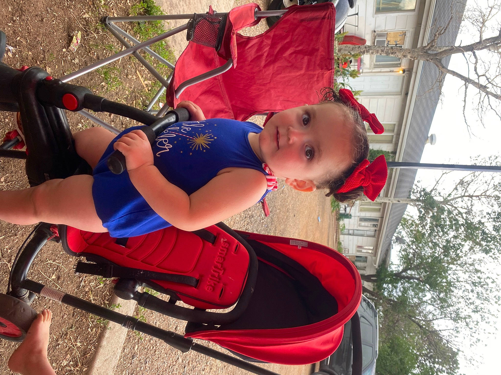 Evelynn is registered to the contest to win money with this photo: baby, baby_toddler_clothing, child, electric_blue, fun, hat, human_leg, knee, leisure, person, plant, public_space, recreation, red, sandal, sitting, thigh, tire, toddler, tree